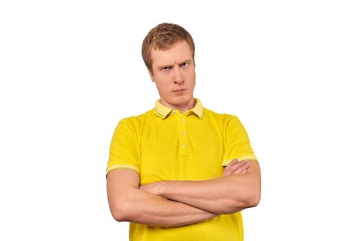 Suspicious man crossed arms on his chest, proud look isolated white background, disappointed emotion photo
