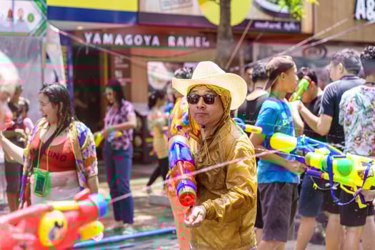 Siam Square, Bangkok, Thailand - APR 13, 2019 short action of people joins celebrations of the Thai New Year or Songkran in Siam Square. photo