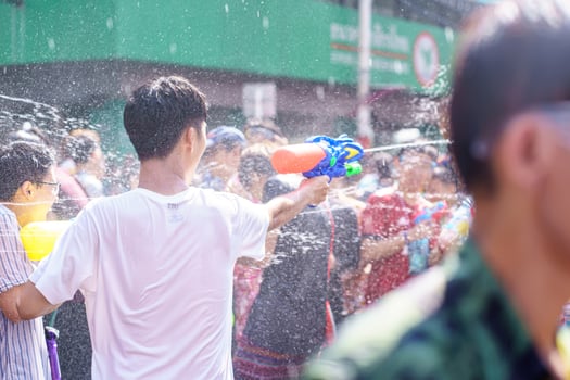 Siam Square, Bangkok, Thailand - APR 13, 2019 short action of people joins celebrations of the Thai New Year or Songkran in Siam Square. photo