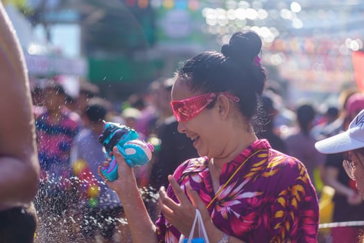 Siam Square, Bangkok, Thailand - APR 13, 2019 short action of people joins celebrations of the Thai New Year or Songkran in Siam Square. photo