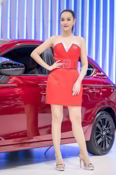 Nonthaburi, Thailand - MAR 27, 2021 Unidentified model poses with a car at The 42th Bangkok International Motor Show Thailand 2021 at IMPACT Arena photo
