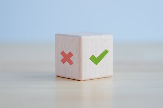 Green correct check mark and red wrong or cross icon on wooden block for true or false changing mindset or way of adapting to change leader and transform quiz answer and poll concept. photo