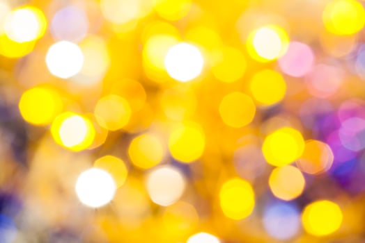 yellow violet blurred shimmering Christmas lights photo