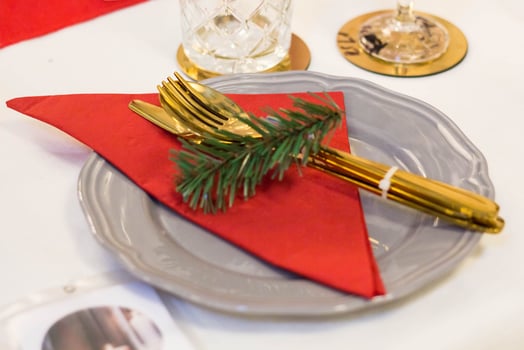 Christmas plate and goldware with red cloth with branch of fir tree photo