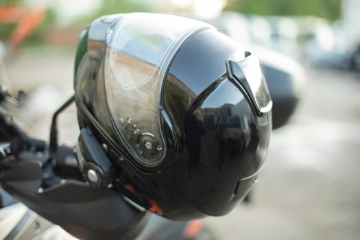 Black motorcyclist helmet. Biker head protection. Safety on road. photo