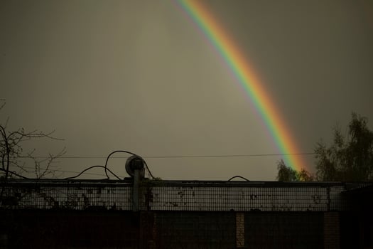 Rainbow in sky. Beautiful weather. Decomposition of light into colors. photo