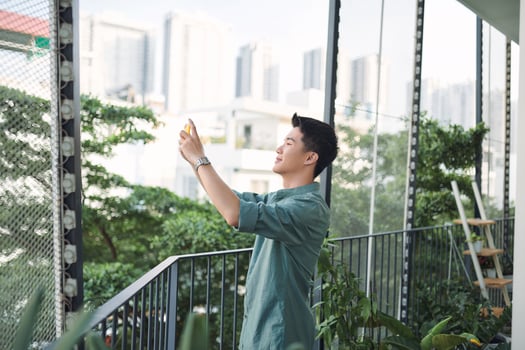 Man photographs a view from the hotel landscape. photo