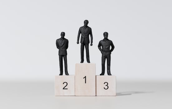 Businessman winner concept. Three businessman on podium photo