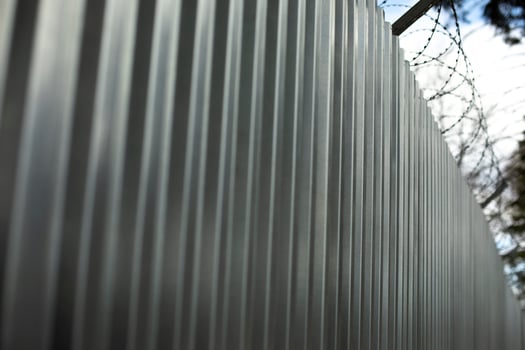 Steel fence. Metal profile. Fence from prof sheet. photo