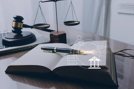 justice and law concept.Male judge in a courtroom on wooden table and Counselor or Male lawyer working in office. Legal law, advice and justice concept. photo