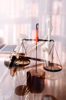 Business and lawyers discussing contract papers with brass scale on desk in office. Law, legal services, advice, justice and law concept picture with film grain effect photo