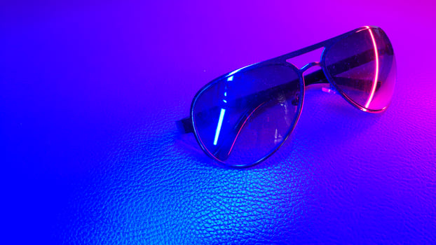 Sunglasses isolated color and light background photo