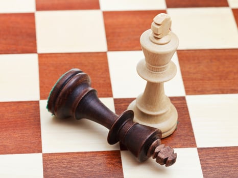 standing and fallen chess kings photo