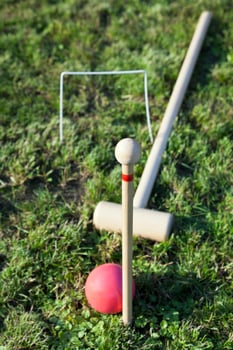 game of croquet on green lawn photo