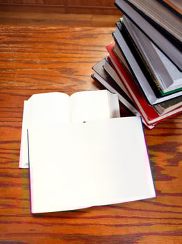 open books on wooden table photo