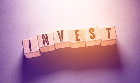 Invest Word with Wooden Cubes photo