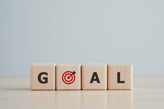 GOAL word on wooden block with dart board. Background for Life target or Business marketing goal. Business achievement goal and objective target. photo