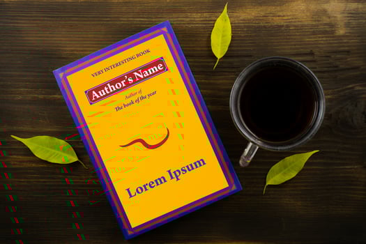 Coffee and book with bright leaves on wood background photo