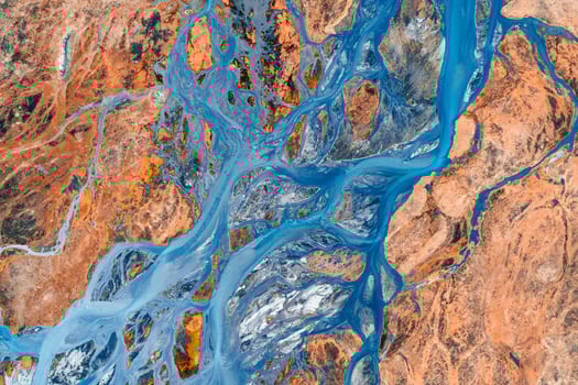 Abstract glacier rivers pattern flowing through volcanic lava field in Icelandic highlands on summer photo