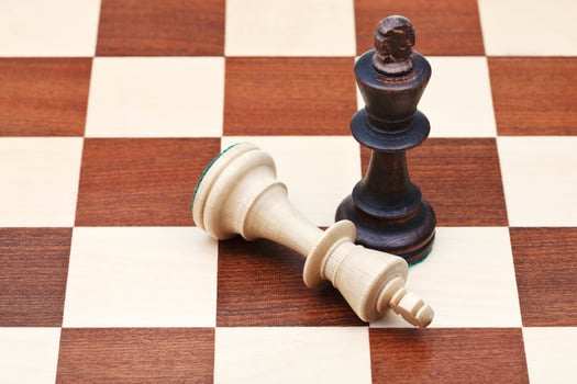 standing and fallen chess kings photo