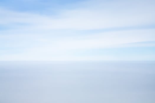 view of horizon line between blue sky and sea photo