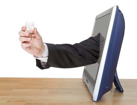 vodka glass in male hand leans out TV screen photo