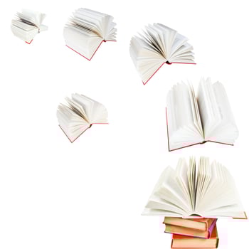 open books fly out of stack photo