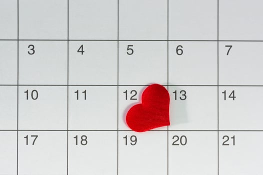 Red heart shape on the date of the 12th day in the calendar. photo