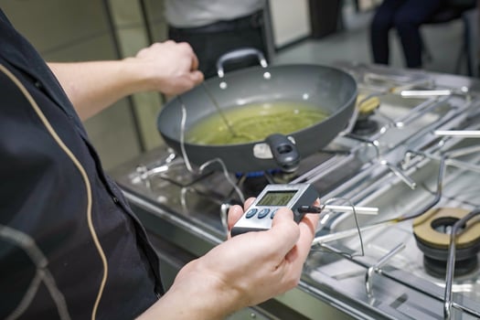 Cooking Themometer measure the degree oil or fried in the pan. photo