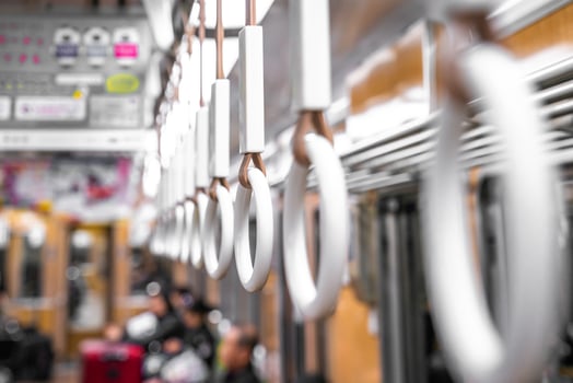Close up Circle plastic hand holding in the underground train Japan. photo