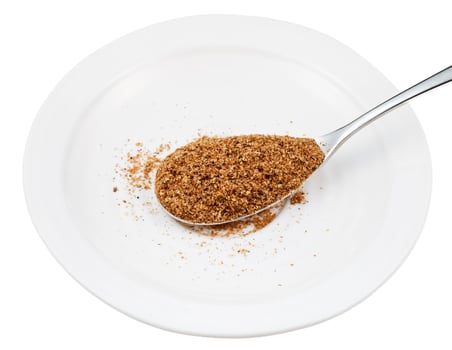 spoon of wheat bran on white plate photo