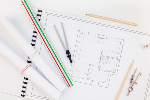 Interior designer table workplace with house plan photo