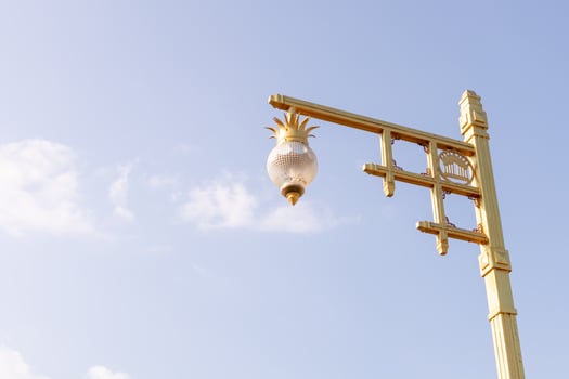 The lamp on the pole With a blue sky background photo