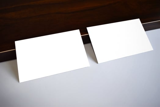 Business card mockup with wooden background photo