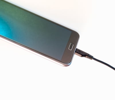 Charger cable connect to smart phone photo