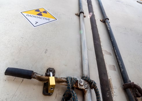 Radiation warning sign on the Dangerous goods transport label Class 7 at the container of transport truck photo