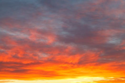bright yellow clouds under blue sky in sunrise photo