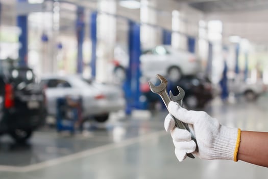 Hand of professional Auto mechanic with wrench photo