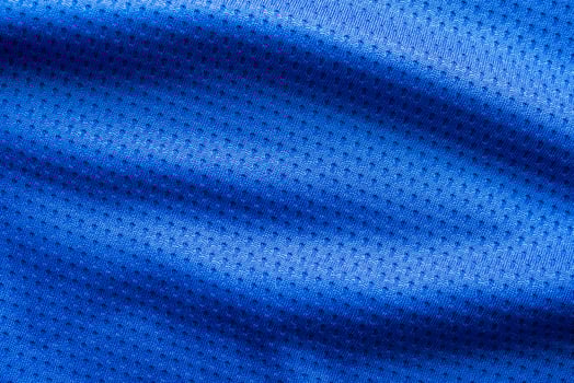 Blue color fabric sport clothing football jersey with air mesh texture background photo
