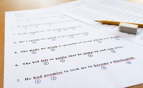 english test and answer sheet on table photo