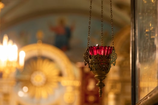 Orthodox Church. Christianity. Festive interior decoration with burning candles and icon in traditional Orthodox Church on Easter Eve or Christmas. Religion faith pray symbol. photo