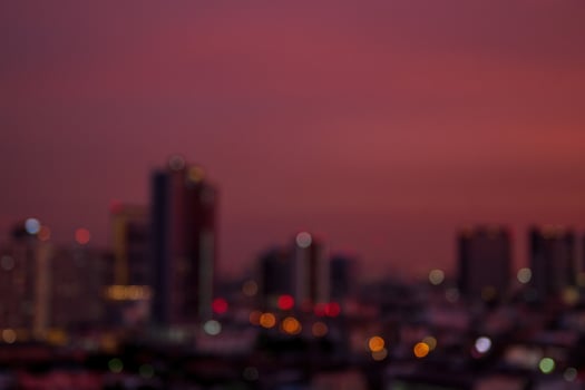 Sunset clear sky background before night over the bokeh light of the city photo