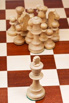 chess figures against the king photo