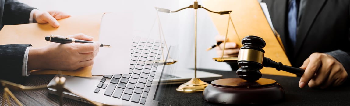 Business and lawyers discussing contract papers with brass scale on desk in office. Law, legal services, advice, justice and law concept picture with film grain effect photo