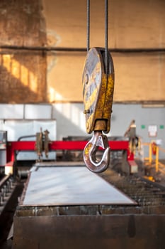 Crane clevis sling hook in an industrial factory. Vertical view. photo