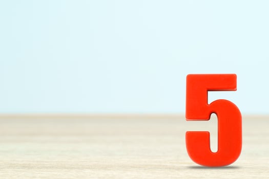Shot of a number five made of red plastic photo