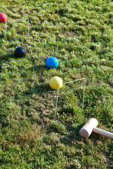 game of croquet on green lawn photo