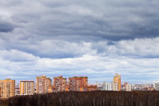 rainy clouds under urban houses photo