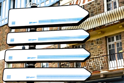 Four white city guide signs photo