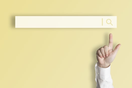 Businessman's finger pointing at internet search page on virtual touch screen Earth tone yellow background, search for internet surfing information network concept, education, knowledge, copy space photo